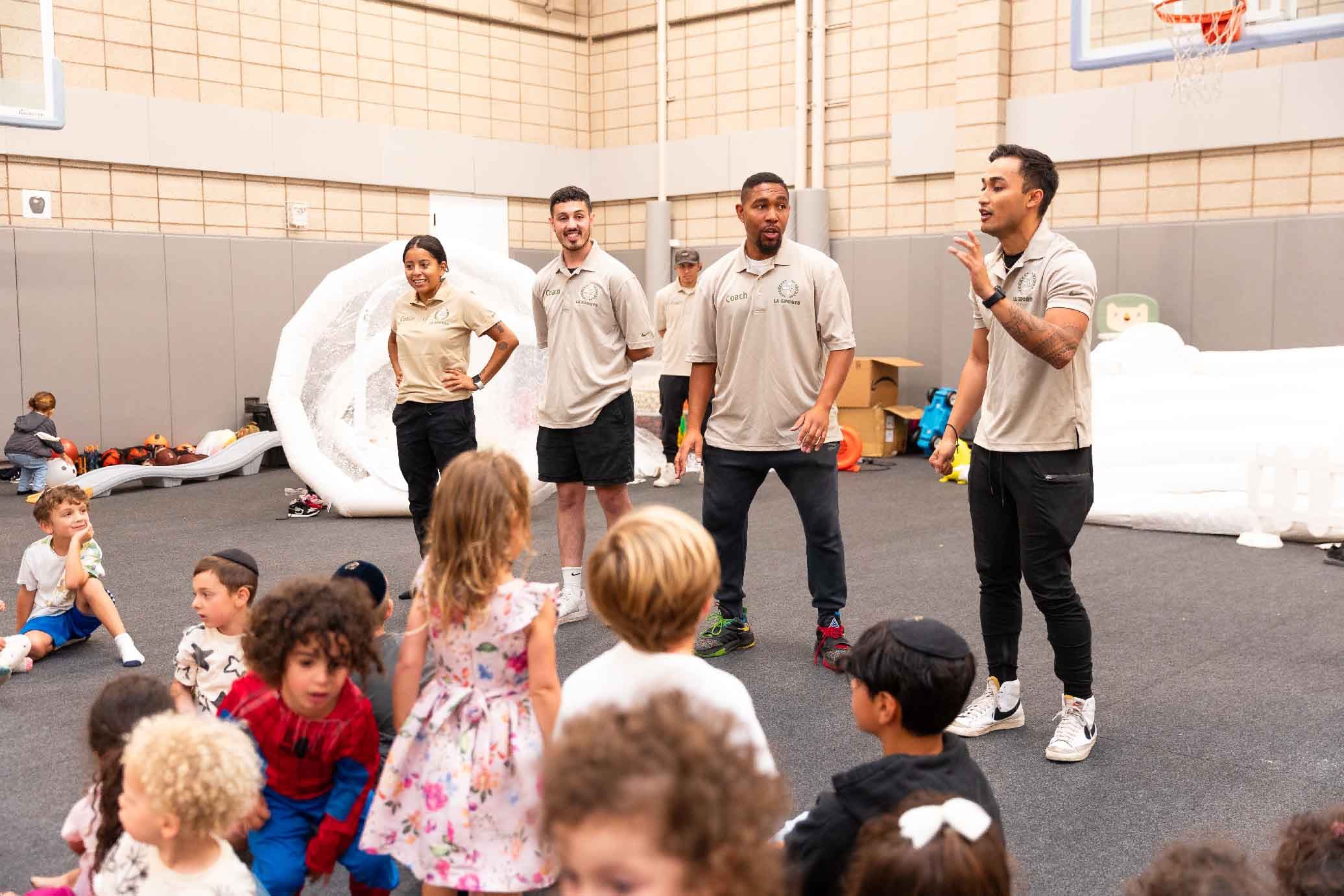 LASW coaches with kids